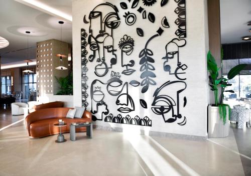 a living room with a wall mural of music notes at Ethno Belek in Belek