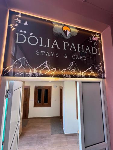 a sign for the dolila paladin stays and garage at Dolia Pahadi Stays & Cafe' in Rānīkhet