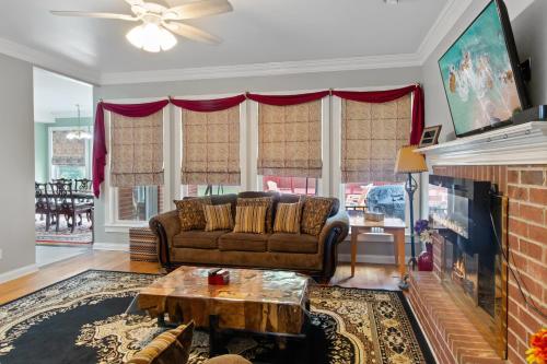 a living room with a couch and a fireplace at Country Cove in Brentwood