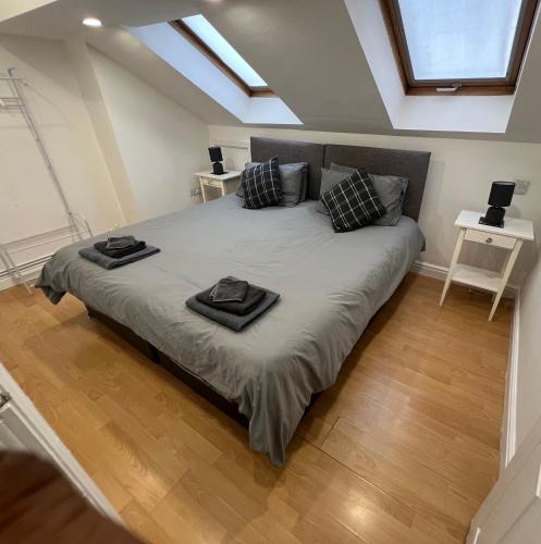 a bedroom with a bed with two pillows on it at Cosy Penthouse suite happily sleeps up to five in Halifax