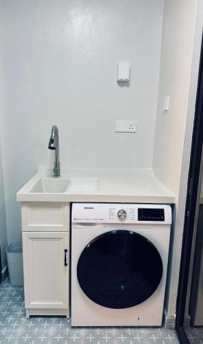 a kitchen with a sink and a dishwasher at Minimalist Heaven Near Tmn Intan in Sungai Petani