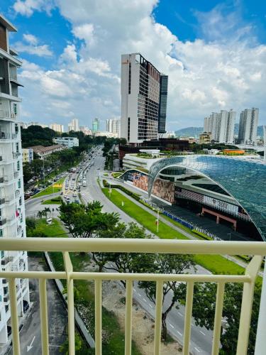 a view of a city from a balcony at Spc Arena Apartment Service in Bayan Lepas