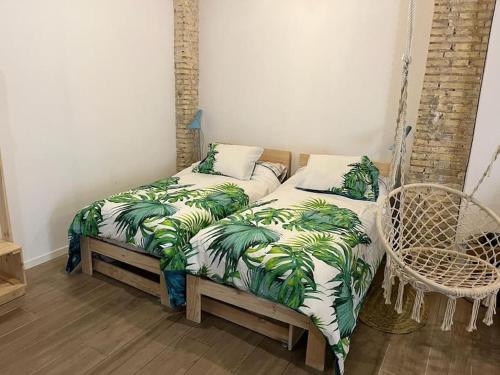 Ένα ή περισσότερα κρεβάτια σε δωμάτιο στο Ruzafa experience Oceanografic ciencias