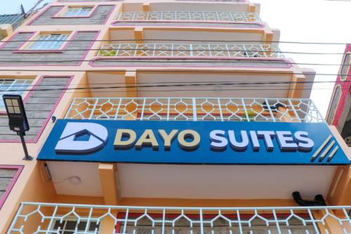 a sign for dayo suites on the side of a building at Dayo Suites and Hotel in Nairobi