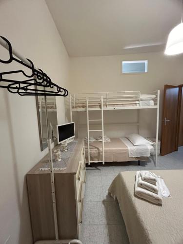 Alle Porte Del Pigno Houseにあるベッド