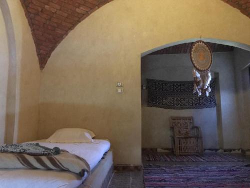 Postel nebo postele na pokoji v ubytování Oum House Siwa