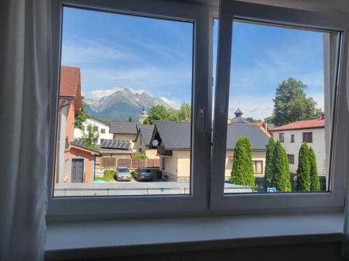 a window with a view of a city at Apartmán Výhľad in Nová Lesná