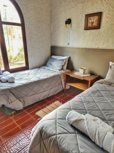 Ένα ή περισσότερα κρεβάτια σε δωμάτιο στο El Torreón Lodge