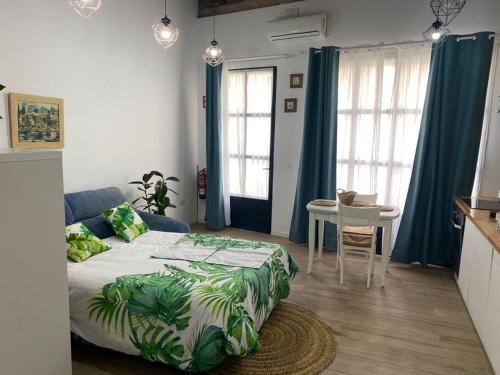 a bedroom with a bed and a table in it at ruzafa oceanograf science center in Valencia