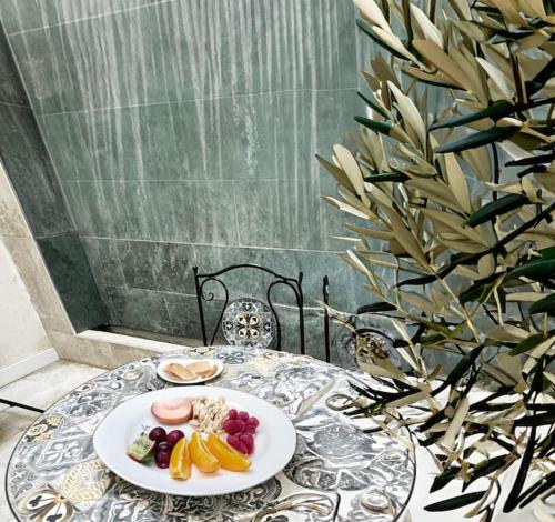 a table with a plate of food on it at Costa by Hawkins Algeciras - Exterior 2A in Algeciras