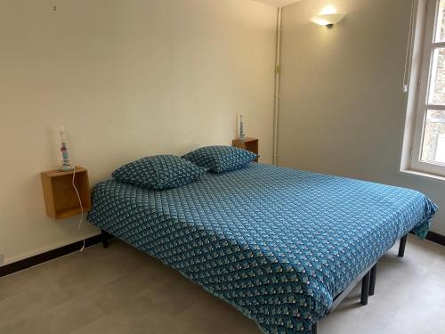 Ένα ή περισσότερα κρεβάτια σε δωμάτιο στο les moulins - studio 7