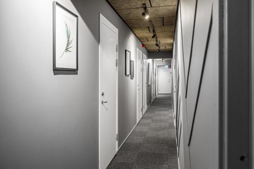 a corridor of an office with white walls at Kallhällsbaden Strandhotell in Stockholm