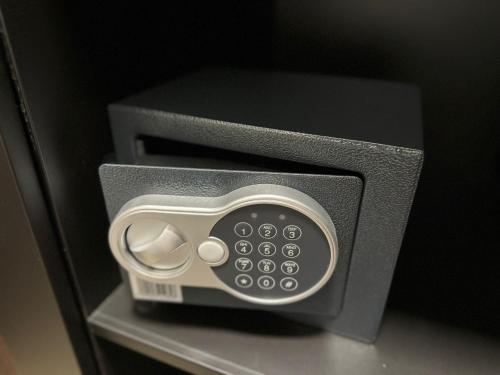 a microwave oven sitting on top of a shelf at Apartment Luxury B in Slavonski Brod