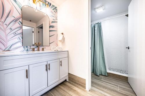 a bathroom with a sink and a shower at One bedroom unit near Epic Universe and Universal, free parking in Orlando
