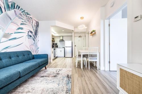 a living room with a couch and a table at One bedroom unit near Epic Universe and Universal, free parking in Orlando