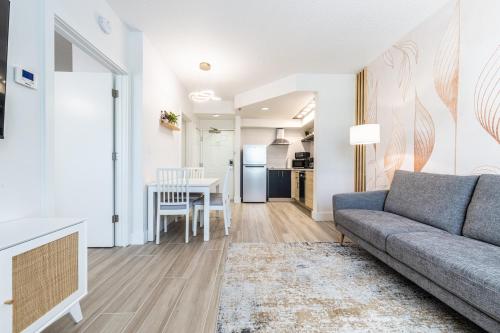 a living room with a couch and a table at Apartment - near Epic Universe and Universal, free parking in Orlando
