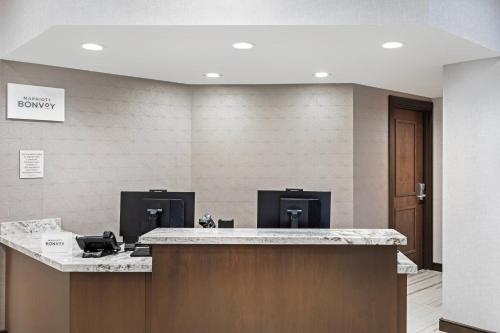 a lobby with a ticket counter with a pay phone at TownePlace Suites by Marriott Austin Northwest The Domain Area in Austin