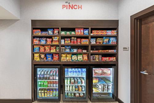a refrigerator in a store with food and drinks at TownePlace Suites by Marriott Austin Northwest The Domain Area in Austin