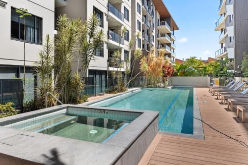 an image of a swimming pool in a building at Modern 2B2B Suit only 10mins to Airport n Southbank in Brisbane