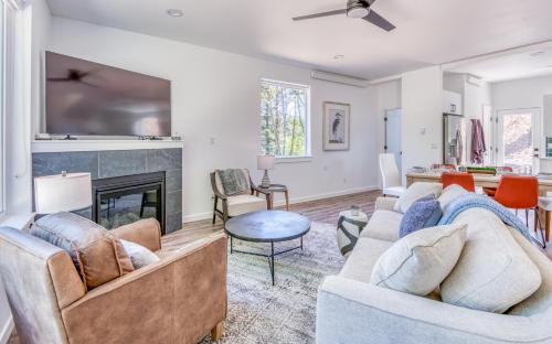 a living room with two couches and a fireplace at Harbor Lights #1 - New Construction Townhome in Depoe Bay