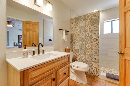 a bathroom with a sink and a toilet and a shower at Full Circle Ranch with Pool and Views in Cave Creek in Cave Creek