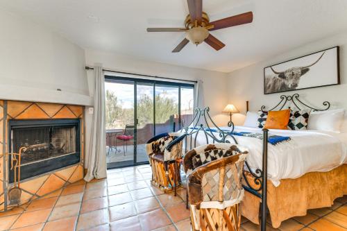 a bedroom with a bed and a fireplace at Full Circle Ranch with Pool and Views in Cave Creek in Cave Creek