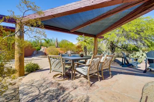 a patio with a table and chairs under a pavilion at Full Circle Ranch with Pool and Views in Cave Creek in Cave Creek