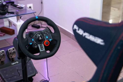 a steering wheel sitting on top of a controller at Kazalika in Marigot