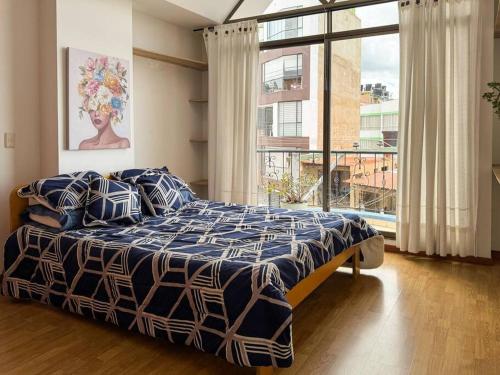 Ένα ή περισσότερα κρεβάτια σε δωμάτιο στο Apartamento de ensueño en Tunja - Boyacá