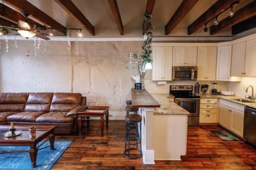 a kitchen with a couch and a table in a room at Decatur Sugar Mill Blues in New Orleans