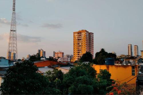 a view of a city with a tower and buildings at Apartamento privativo em Belem - Bairro Marco in Belém