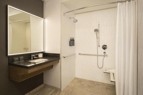 a bathroom with a sink and a shower at The Westin Palo Alto in Palo Alto