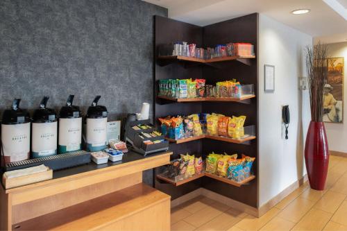 a store with bottles of wine and snacks on shelves at Fairfield by Marriott in Troy