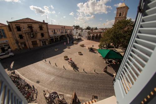 an overhead view of a courtyard in a city at Hotel Opera in Larnaca