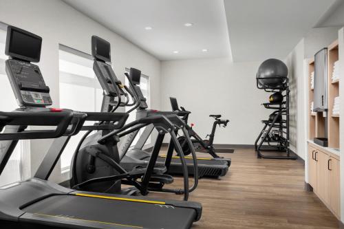a gym with treadmills and elliptical machines at Residence Inn by Marriott Ocean Township in Oakhurst