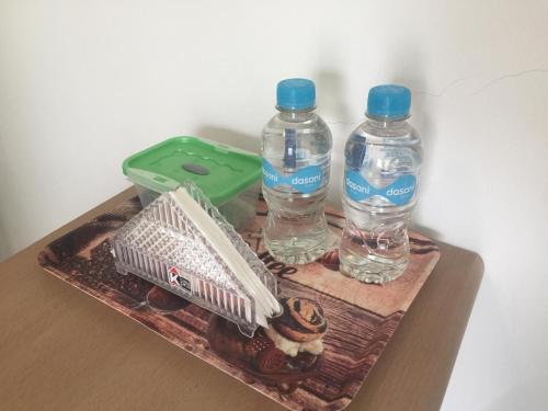 a tray with two bottles of water on a table at Casa Bella Salinas in Salinas