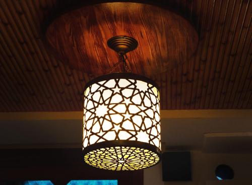 a chandelier hanging from a ceiling in a room at Dar sultana in Rabat