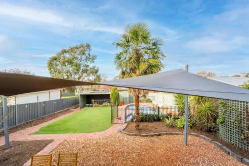 a view of a house with a tent and a yard at Cambridge House, Bendigo in Bendigo