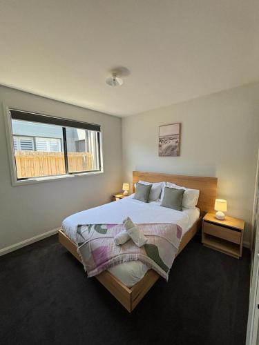 a bedroom with a large bed and a window at Seaside Retreat, St Leonards in Saint Leonards