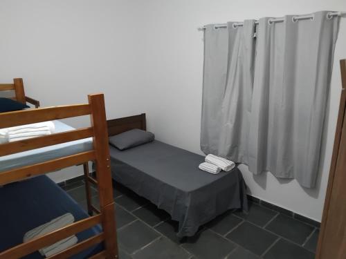 Ένα ή περισσότερα κρεβάτια σε δωμάτιο στο Casa com alojamento, para até 18 pessoas