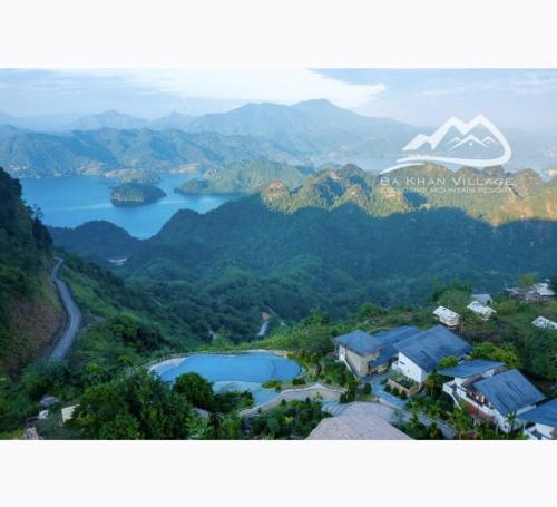 an aerial view of a mountain and a lake at Bakhan Village Resort in Mai Chau