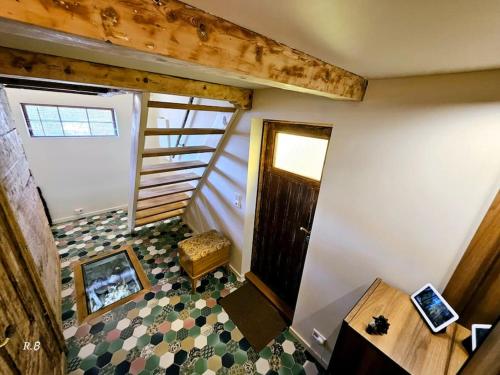 an overhead view of a room with a staircase and a door at OAH 1870 Oldest Alesund House in Ålesund