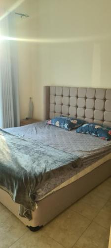 a large bed in a room with a large mattress at Jlt L cluster preatoni tower in Dubai