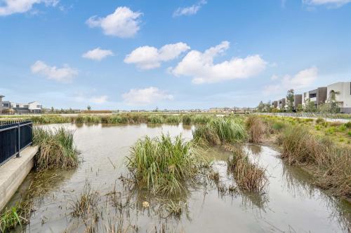 a body of water with grass in it at Dream Family Retreat ! Escape Relax and Rejuvenate in Berwick