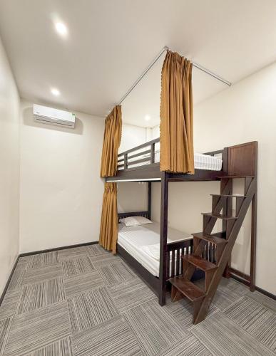 Ένα ή περισσότερα κρεβάτια σε δωμάτιο στο MiChoc Homestay - Hostel