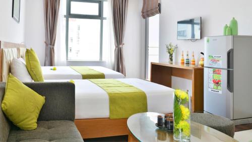 Letto o letti in una camera di Richico Apartments And Hotel