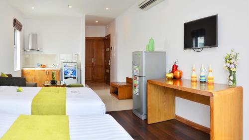 Letto o letti in una camera di Richico Apartments And Hotel