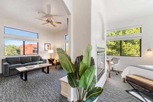 a living room with a bed and a couch at Las Posadas of Sedona in Sedona