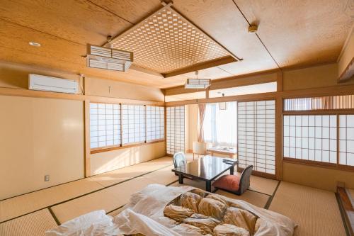 Cama o camas de una habitación en Hokkawa Onsen Hotel