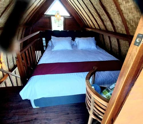 Ένα ή περισσότερα κρεβάτια σε δωμάτιο στο Thula Thula Bali Villas
